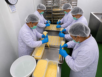 Gelato filling process inside chocolate molds